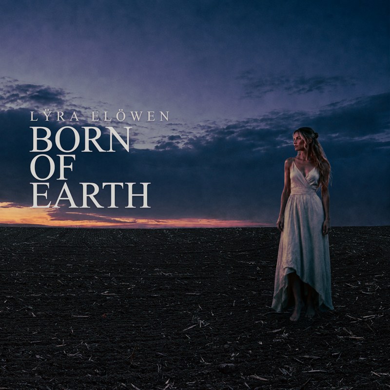 Born of Earth &mdash; a woman standing in a ploughed field beneath a wide dusk sky